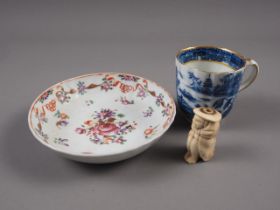 A 19th century Chinese blue, white and gilt decorated tea cup (hairline crack), a 19th century