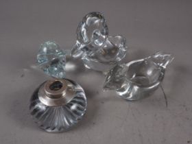 A domed glass inkwell with silver top, two glass dishes, moulded as birds, a glass pig