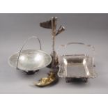 Two silver plated swing handle baskets, a white metal candlestick/table centre and a brass
