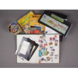 A quantity of first day covers, loose stamps from around the world, a stock book and albums