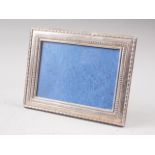 A silver photo frame, 9" high overall