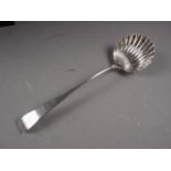 A Georgian silver shell bowl bottom marked ladle, 5oz troy approx