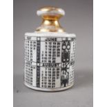 Piero Fornasetti: an Italian porcelain insulator shaped paperweight, decorated calendar and signs of