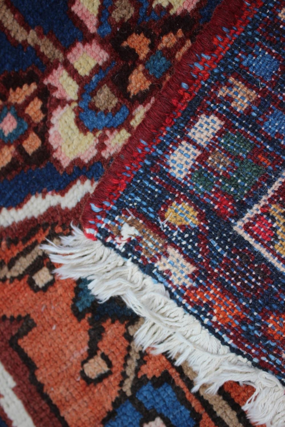 A Hamadan carpet with central star design, on a salmon ground, in shades of blue, brown, pink, - Image 14 of 14