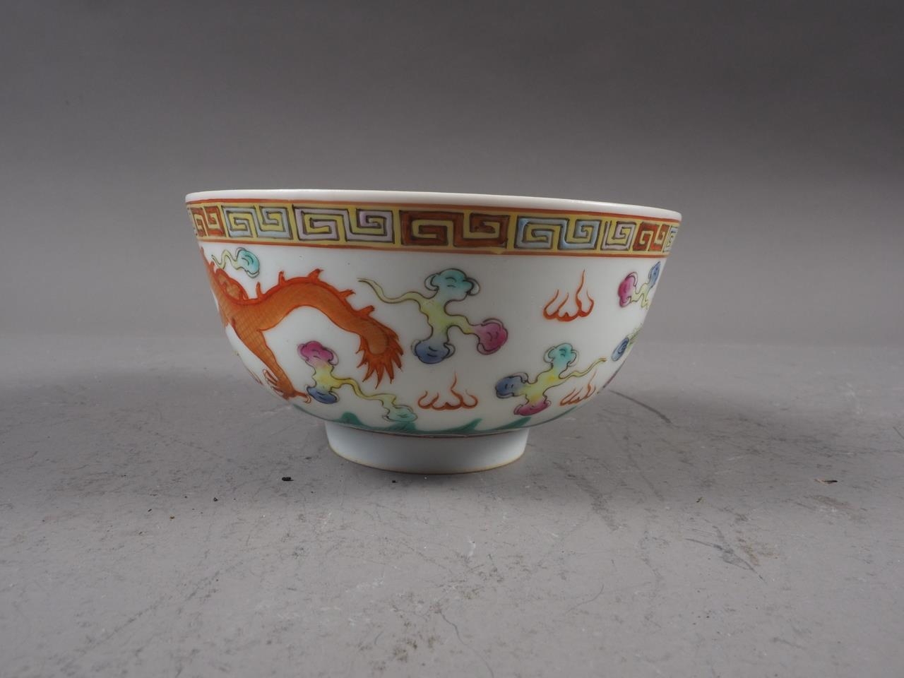 A Chinese porcelain phoenix and dragon decorated bowl with six-character mark, 4 1/2" dia