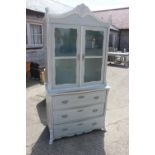 A French grey and white painted serpentine front dresser with glazed upper section enclosed two