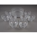 A Finnish mottled clear glass bowl, 9" dia x 4" high, and eight similar bowls, 4" dia x 3 1/2" high