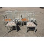 A set of six grey painted pierced splat back dining chairs with drop-in seats, on chamfered and