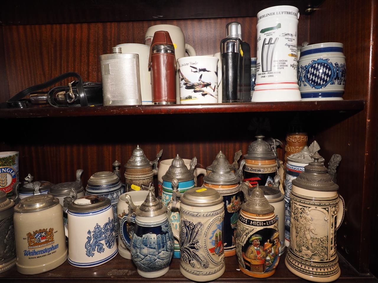 Three Goebel blue and grey tankards, a quantity of other relief decorated tankards, hip flasks and