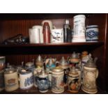Three Goebel blue and grey tankards, a quantity of other relief decorated tankards, hip flasks and