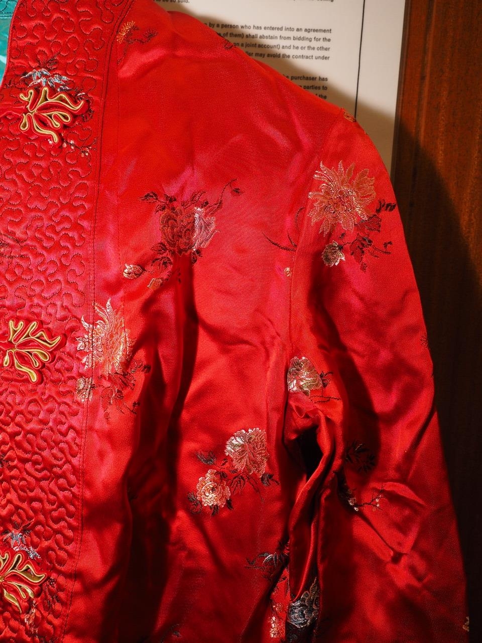A Chinese silk and fur jacket, embroidered with mythical beast and plant designs on a blue ground, - Image 2 of 4