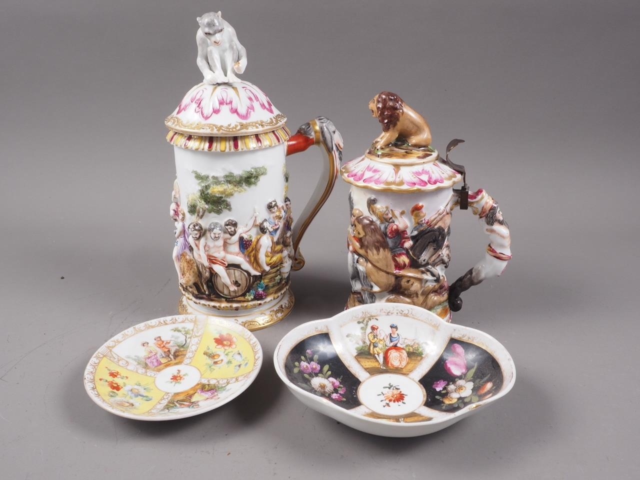 Two Capodimonte tankards and covers, with classical figure decoration, 9" high, and lion hunt, 7"