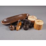 A Black Forrest ashtray and matchbox holder, carved as a bear, 4" long, a turned wooden ring