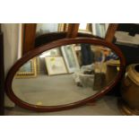 An Edwardian mahogany and inlaid wall mirror with bevelled plate, 31" x 19" overall
