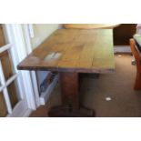 An Arts & Crafts oak planked top refectory table, on twin supports, 58" wide x 35 1/2" deep x 30"