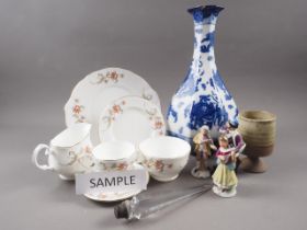 A Doulton Olympia vase, 14 1/2" high, a Duchess bone china teaset, three porcelain figures, etc