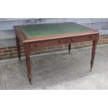 An early 19th century mahogany writing table with tooled green leather lined top, fitted four