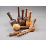A lignum vitae mallet, 400g, a lignum vitae mallet, 453g, an oak mallet, 365g, and four others