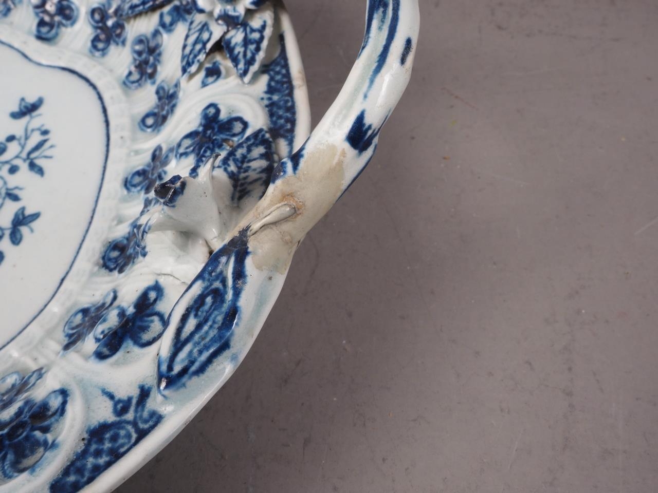 A mid 18th century blue and white Worcester relief decorated two-handled dish, 11" wide (handles - Image 2 of 3