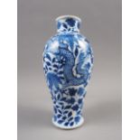 A Chinese blue and white baluster vase with dragon and flower decoration and six-character mark to