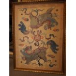A Chinese silk embroidery with mythical beast, cloud and flaming pearl designs, in gilt strip frame,