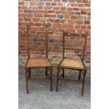 Two pairs of Edwardian mahogany and line inlaid cane seat bedroom chairs