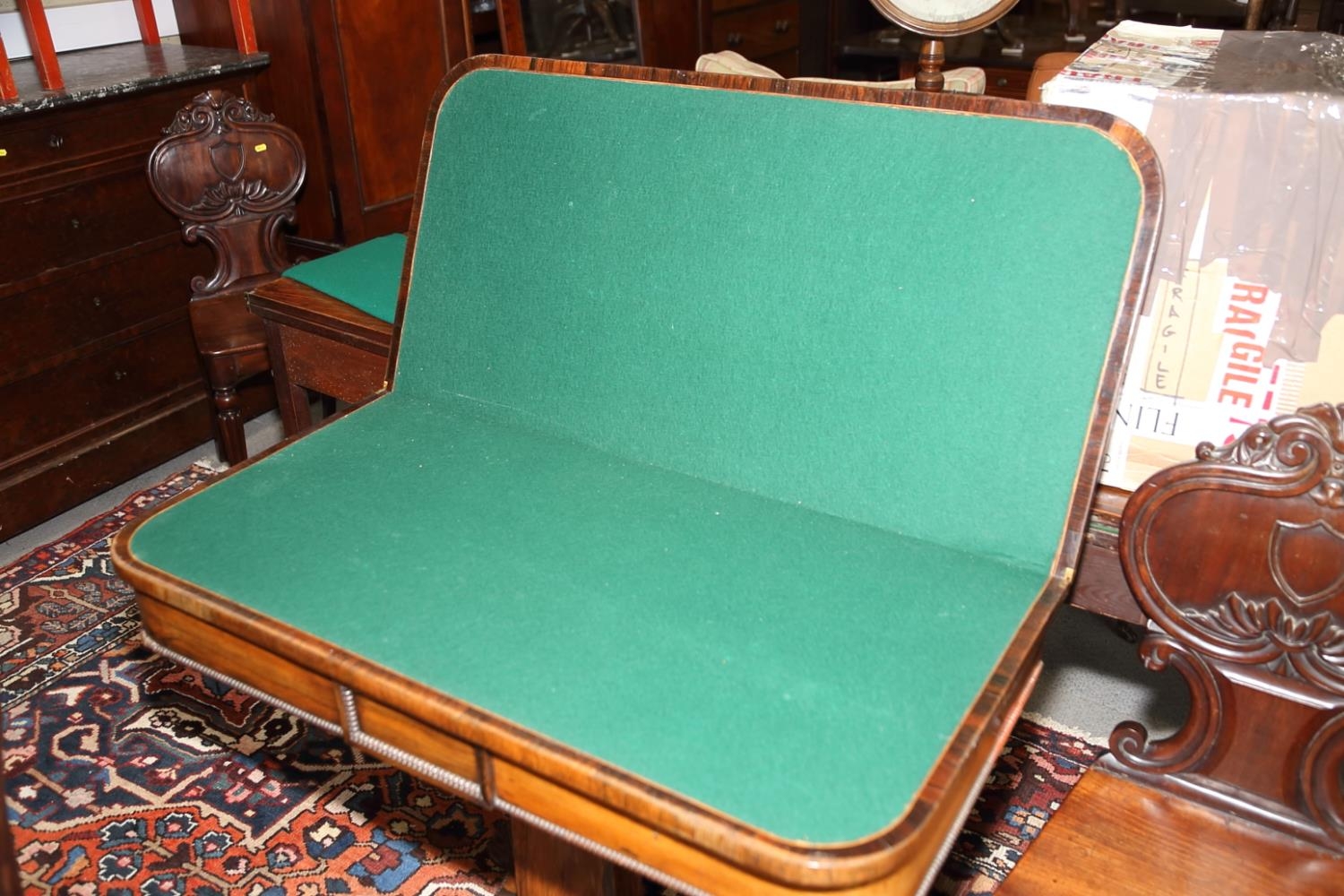 A 19th century rosewood fold-over card table, on quadraform lion claw supports, 36" wide - Bild 3 aus 6