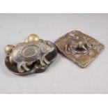A bronze dish, decorated as a swan, a square bronze paperweight, moulded as a frog, a brass pig dish