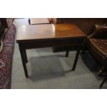 A Georgian mahogany fold-over top tea table, on chamfered supports, 36" wide x 17" deep x 29" high