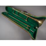 A Skylark brass trombone, in case