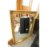 A rectangular gilt framed wall mirror with bevelled plate, 45" x 35"