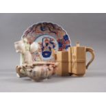 A Chinese carved soapstone teapot, an Imari decorated dish, a Chinese Yixing type pottery teapot and