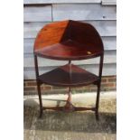 An early 20th century mahogany bowfront corner washstand, on splay supports, 26" wide x 17" deep x