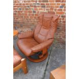 An Ekorns tan leather stressless recliner armchair and matching stool