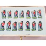 A Britains painted lead figure "46 PC Marching Band", in a two-tier wooden case, and a W Britain