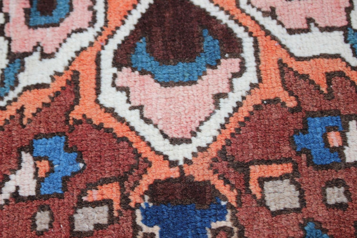 A Hamadan carpet with central star design, on a salmon ground, in shades of blue, brown, pink, - Image 7 of 14