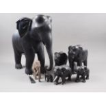 Seven carved ebony elephants, various sizes, largest 15" high
