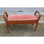 An Edwardian walnut box seat duet stool, on square taper supports, 41" wide x 11 1/2" deep x 25"