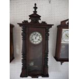 A polished as mahogany regulator style wall clock with shaped pediment and eight-day striking