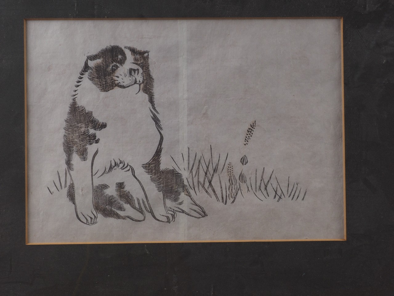 A Japanese print, study of a dog, in gilt strip frame, another print, study of a robed rodent, and