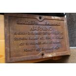 A Southern Railway cast iron "Warning" sign, 24 1/2" wide x 15 1/2" high
