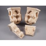 A pair of carved limewood corbels of 13th century design, 12 1/4" high, a carved lime wood