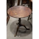 A mahogany circular tray top occasional table, 23" dia, and a similar circular occasional table,