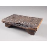 An early 19th century carved hardwood mancala game board, said to have come from HMS Aboukir circa