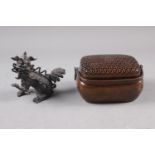 A rectangular bronze pot pourri basket with perforated cover and swing handle, 6" across, and a