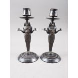A pair of late 19th century cast bronze Egyptian taste candlesticks, on marble bases, 8 1/4" high