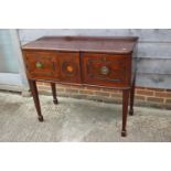 A 19th century mahogany and ebony strung cross banded break bowfront sideboard, fitted two