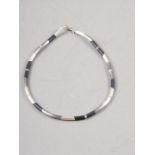 A titanium and silver mounted sectional necklace