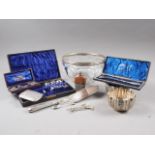 A glass fruit bowl with silver plated rim, a white metal cake slice, cased cutlery and other