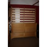 An Ercol light oak panel end bed, 68" wide